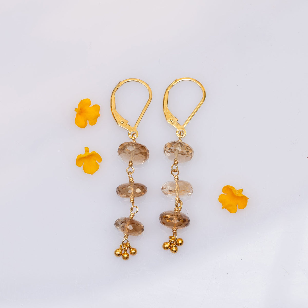 Stay Neutral champagne topaz gold drop earrings on display stand showing gradient and gold ball detail – Breathe Autumn Rain