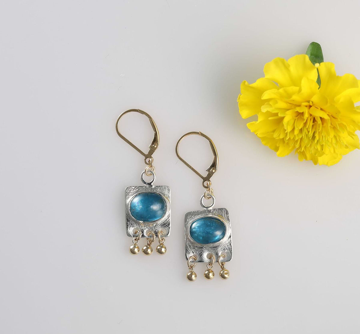 Neon blue tourmaline gemstone earrings in handcrafted mixed metal setting