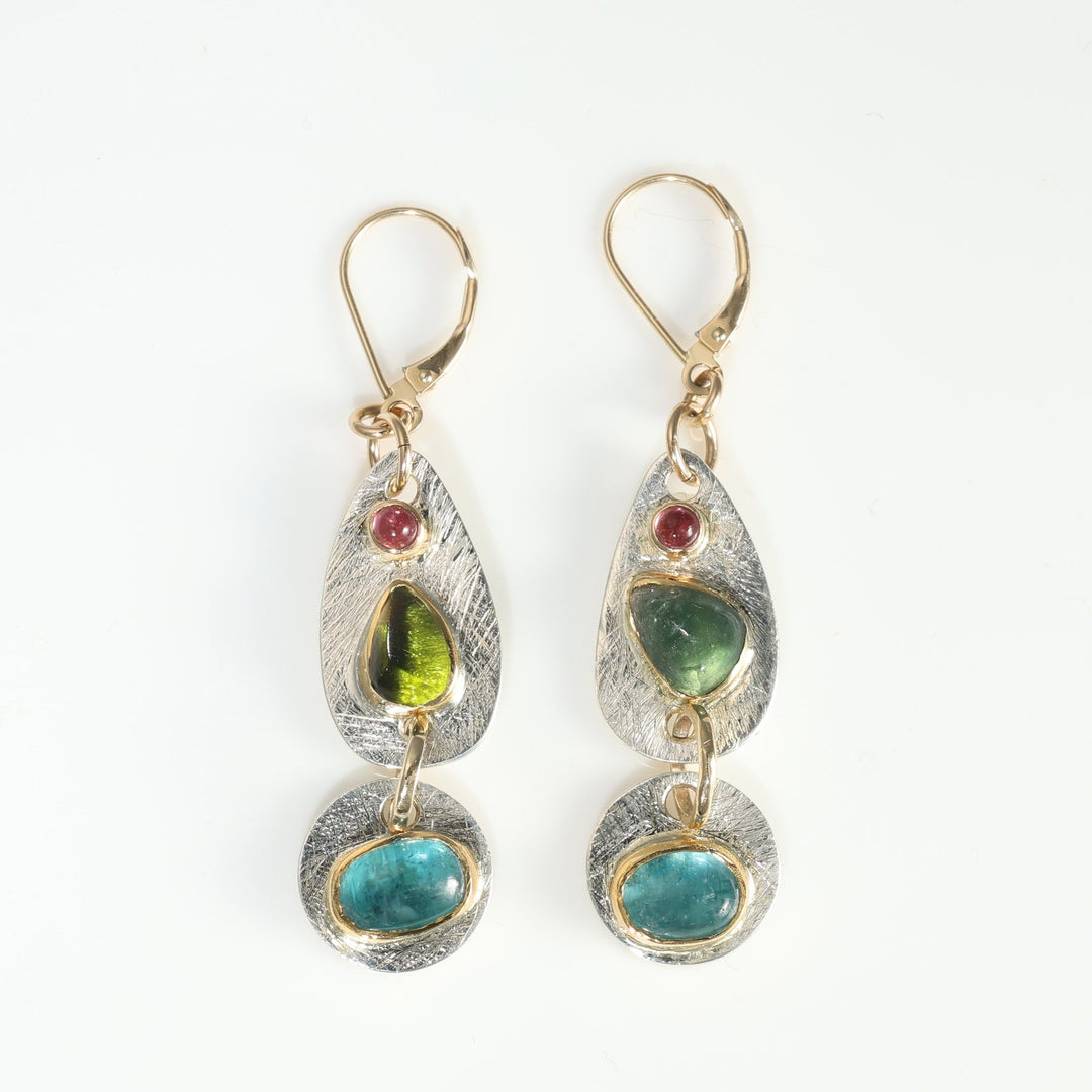 multi-gemstone drop earrings on white background