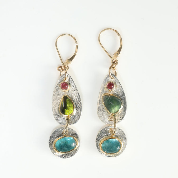 multi-gemstone drop earrings on white background