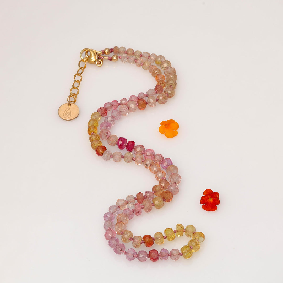 Peonies in Bloom padparadscha sapphire necklace S-curve layout showing silk knotting detail – Breathe Autumn Rain