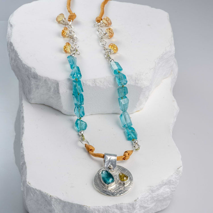 Beach Party necklace with rare Paraiba blue and golden tourmalines set in Argentium silver, silk and sapphire strand — handcrafted by Breathe Autumn Rain.
