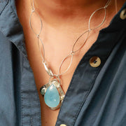 Theia - Aquamarine Pendant Silver Necklace lifestyle closeup image | Breathe Autumn Rain Artisan Jewelry