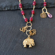 Bali In Bloom - Elephant Lotus Om Pendants Natural Ruby Necklace - closeup image | BreatheAutumnRain