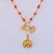Bali in Bloom - Carnelian Gold Elephant Lotus Om Pendants Necklace detail image | Breathe Autumn Rain Artisan Jewelry