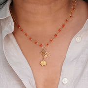 Bali in Bloom - Carnelian Gold Elephant Lotus Om Pendants Necklace life style image | Breathe Autumn Rain Artisan Jewelry