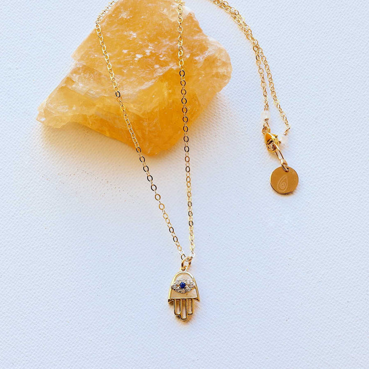 Kioni - Gold Evil Eye Hamsa Necklace alt image | Breathe Autumn Rain Artisan Jewelry